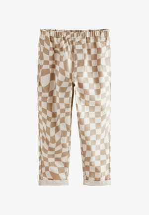 Pantalons en coton checks beiges et blancs avec une coupe décontractée, taille élastique et ourlets retroussés. Présente un motif ondulé sur le tissu.