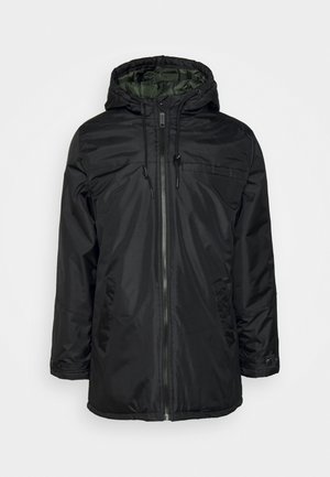 Black insulated jacket with a hood, front zipper, and drawstring. Features a smooth exterior, side pockets, and a green lined interior.