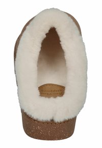 Brown slipper with a soft, white fur lining. Features a rounded opening and a cork-like textured sole, offering a cozy appearance.