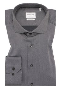 Schwarz-weiß gemustertes Hemd mit modernem Schnitt, Knopfverschluss und umschlagbarem Kragen, ausgestattet mit einer Brusttasche und glatter Textur.