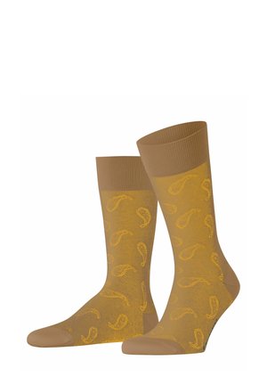 Tan knee-length socks with a ribbed top, featuring a yellow paisley pattern throughout and a smooth texture.