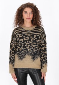Bézs és fekete pulóver, állatmintás, bolyhos textúrájú, flitterekkel díszített, kerek nyakú és hosszú ujjú.