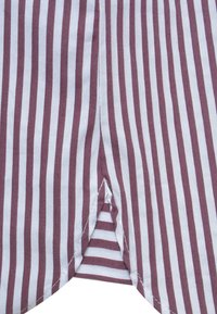 Striped fabric with alternating maroon and white vertical lines. Features a triangular slit at the bottom center. Cotton texture, smooth finish.