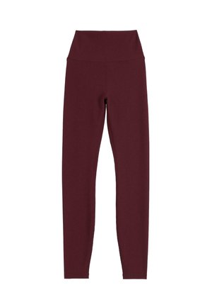 Bordeaux geribbelde legging met een hoge tailleband. De stof lijkt zacht, rekbaar en glad, ontworpen voor comfort en flexibiliteit.
