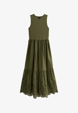 Robe sans manches vert olive avec un corsage ajusté et une jupe à volants, ornée de découpes en dentelle au niveau de l'ourlet. Fabriquée en tissu doux.