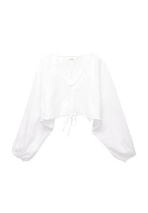 Blouse blanche courte avec un large col en V, des manches longues amples, un cordon de resserrage à l'ourlet et un tissu texturé.