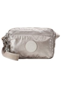 Padded silver crossbody bag with a textured finish, a front zipper pocket, and a round logo patch. Features a woven strap for easy carrying.