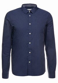 Camicia a maniche lunghe di colore blu navy con colletto button-down, caratterizzata da una piccola stampa a pois bianchi e chiusura frontale con bottoni bianchi.