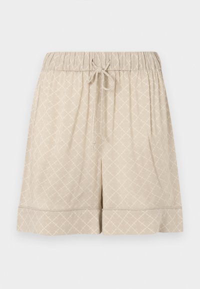 Béžové šortky vyrobené z mäkkej látky s elastickým pásom, šnúrkou na stiahnutie a textúrou v diamantom. Majú obšitý lem.