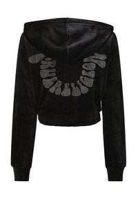 Haut en hoodie noir court en tissu pelucheux, avec une capuche, des manches longues et des embellissements en strass argentés formant un motif courbé dans le dos.