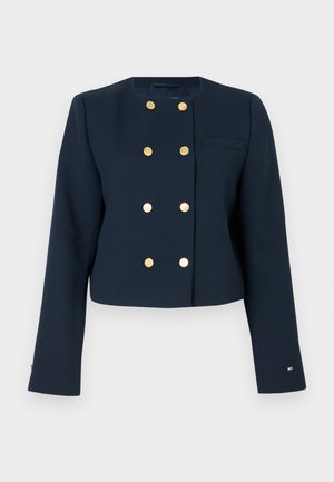 Sötétkék, zakó fazonú, cropped kabát, texturált anyagból készült, arany, dupla gombos záródással és egyetlen mellzsebbel.