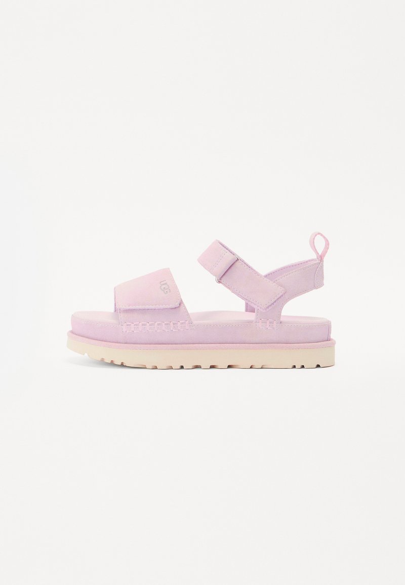 Rosa semskede sandaler med polstret såle, justerbar rem og teksturert overdel. Lett design med en løkke på hælen for enkel påkledning.
