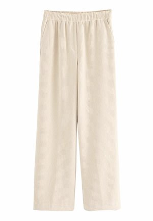 Pantalon large en velours côtelé beige avec taille élastique et poches latérales, conçu pour un usage décontracté.