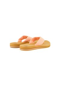 Pink flip-flops with a textured fabric strap featuring a geometric pattern and a flat, light brown rubber sole with a subtle striped accent.