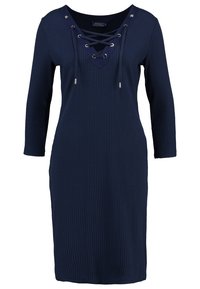 Navy blue ribbed dress with a V-neck and lace-up detail. Long sleeves and silver-tone hardware accents. Soft, textured fabric.