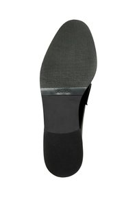 Suola di scarpa in gomma nera con un motivo di grip testurizzato. Presenta un tacco arrotondato e liscio. Logo "Vibram" visibile a metà suola.