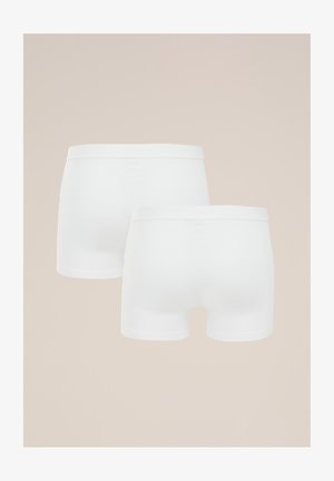 Witte katoenen boxershorts met een naadloos design, een elastische tailleband en een zachte textuur, met een lengte tot halverwege de dij en zonder zichtbaar patroon.