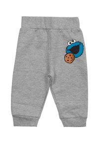 Pantaloni grigi in felpa con vita e polsini a costine, caratterizzati da un personaggio Cookie Monster blu con una grafica di biscotto sulla gamba sinistra.