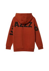 Un hoodie de couleur rouille avec un grand motif graphique noir au dos. Il dispose d'une capuche à cordon et de poignets et d'un ourlet côtelés.