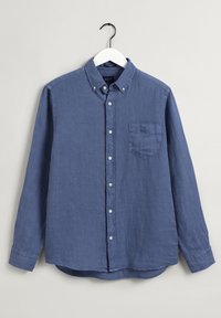 Camicia con bottone in tessuto blu scuro uniforme. Presenta un colletto, maniche lunghe e una tasca frontale. Realizzata in materiale leggero.