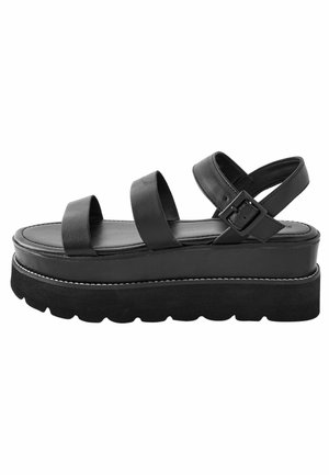 Sandales à plateforme noires avec une tige en cuir lisse, comportant deux larges sangles et une sangle de cheville réglable. Semelle élastique avec finition texturée.