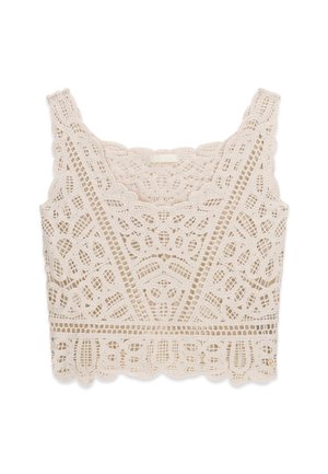 Kremowy krótki top z koronki szydełkowej z falistymi brzegami oraz skomplikowanymi kwiatowymi i geometrycznymi wzorami.