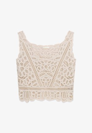 Kremowy krótki top z koronki szydełkowej z falistymi brzegami oraz skomplikowanymi kwiatowymi i geometrycznymi wzorami.