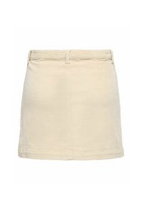 Jupe mini en velours côtelé beige avec une surface texturée, présentant une coupe droite, des passants de ceinture et un ourlet standard. Pas de poches visibles.