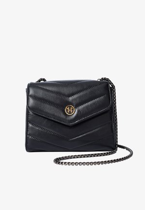 Black quilted leather crossbody bag with chevron pattern, fold-over flap, gold-tone logo, and chain strap. Compact design for easy carrying.