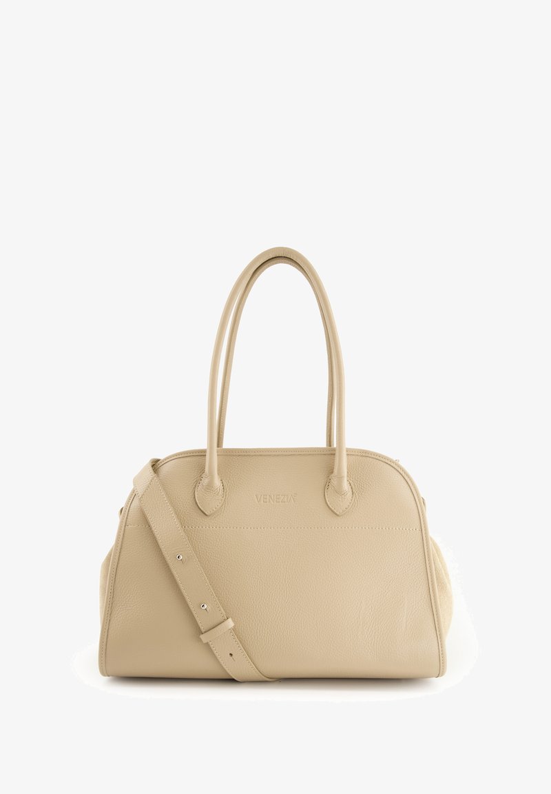 Beige leather handbag with two rounded handles, a detachable shoulder strap, and a logo on the front. Smooth texture and curved shape.