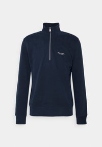 Felpa zip-up blu navy realizzata in tessuto morbido. Presenta un colletto rialzato, maniche lunghe e un piccolo logo bianco sul lato sinistro del petto.
