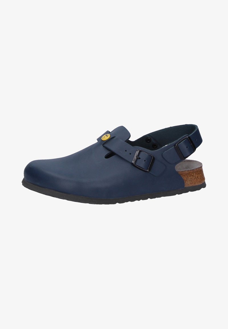 Navy blue clogs made from smooth rubber with a round toe, adjustable strap, and cork accent on the heel. Textured rubber sole for grip.