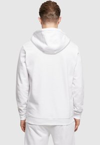 Merchcode BE HAPPY  - Hoodie - white