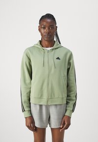 adidas Sportswear FUTURE ICONS THREE STRIPES FULL ZIP - Camisola com fecho - tent green