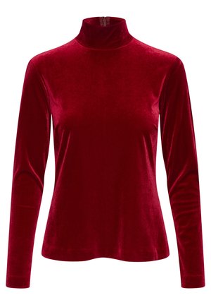 Top lungo in velluto rosso con maniche lunghe, collo alto e zip sul retro. Tessuto liscio e silhouette aderente, che mette in risalto una finitura lucida.