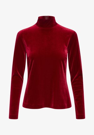 Duga majica od crvenog baršuna s dugim rukavima, visokom ovratnikom i zatvaračem na leđima. Glatka tekstura i prilagođen silueta ističu sjajni finiš.