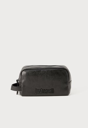 Black synthetic leather toiletry bag with a rectangular shape, embossed "Just Cavalli" logo on the front, and a side handle.