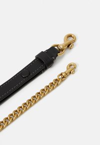 Black leather strap and gold chain with matching gold swivel clasps on white background.