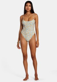 Floral one-piece swimsuit with thin straps, light blue background, orange and white flower pattern, slim fit, high-cut leg openings.