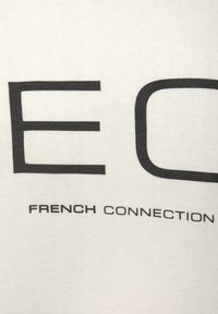 White fabric t-shirt featuring large, bold black text that reads "ECO" and "FRENCH CONNECTION" near the bottom, smooth texture.