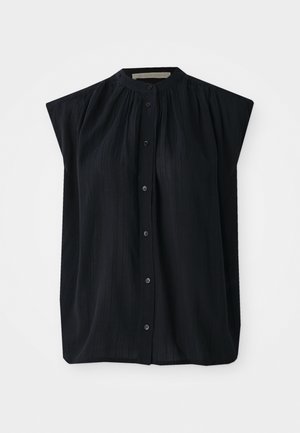 Black short-sleeved shirt with a mandarin collar, featuring vertical pleating and a full button front. Soft fabric with a smooth texture.