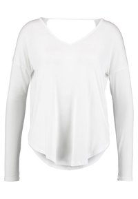 Maglietta bianca a maniche lunghe con scollatura a V profonda e taglio sulla schiena. Realizzata in tessuto leggero, presenta una vestibilità comoda e un orlo arrotondato.