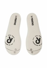 Paire de semelles intérieures en tissu beige avec le logo noir "reima" et le texte circulaire "Joy of Movement Since 1944" imprimé sur chacune.