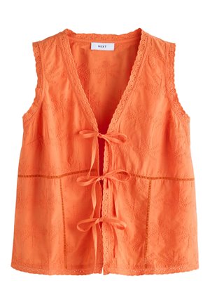 Gilet orange sans manches avec motifs de palmiers brodés, bords festonnés et trois fermetures à nouer à l'avant.