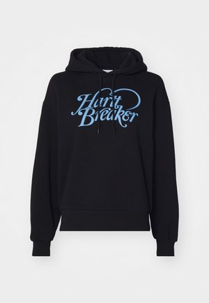 Svart hettegenser med løs passform, med et lett blått "Heart Breaker"-design på forsiden. Laget av myk, teksturert stoff.