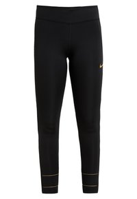 Leggings neri realizzati con tessuto elasticizzato. Presentano il logo Nike dorato e cuciture dorate a contrasto all'orlo. Tessuto liscio con design aderente.