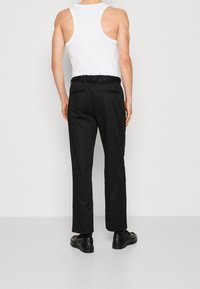 Calvin Klein Trousers - black