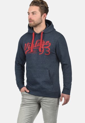 Marineblauwe hoodie van zacht materiaal, voorzien van een grote rode "Vintage" graphic, met trekkoorden, een kangoeroezak en geribbelde manchetten.