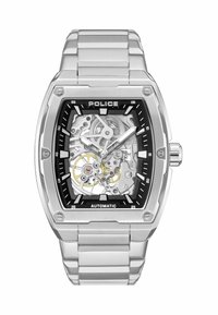 Srebrny zegarek automatyczny ze stali nierdzewnej z kwadratową szkieletową tarczą, czarną obręczą i widocznymi zębatkami. Posiada wyraźne znaczniki godzin oraz metalową bransoletę ogniwową.