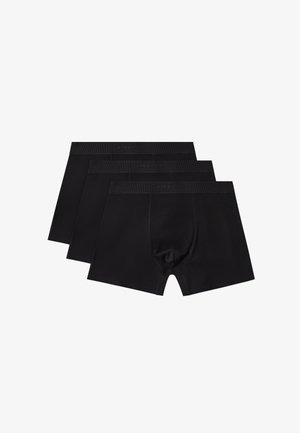 Trzy czarne męskie bokserki ułożone na sobie, z elastycznymi pasami w talii i profilowaną przednią kieszenią dla wsparcia.